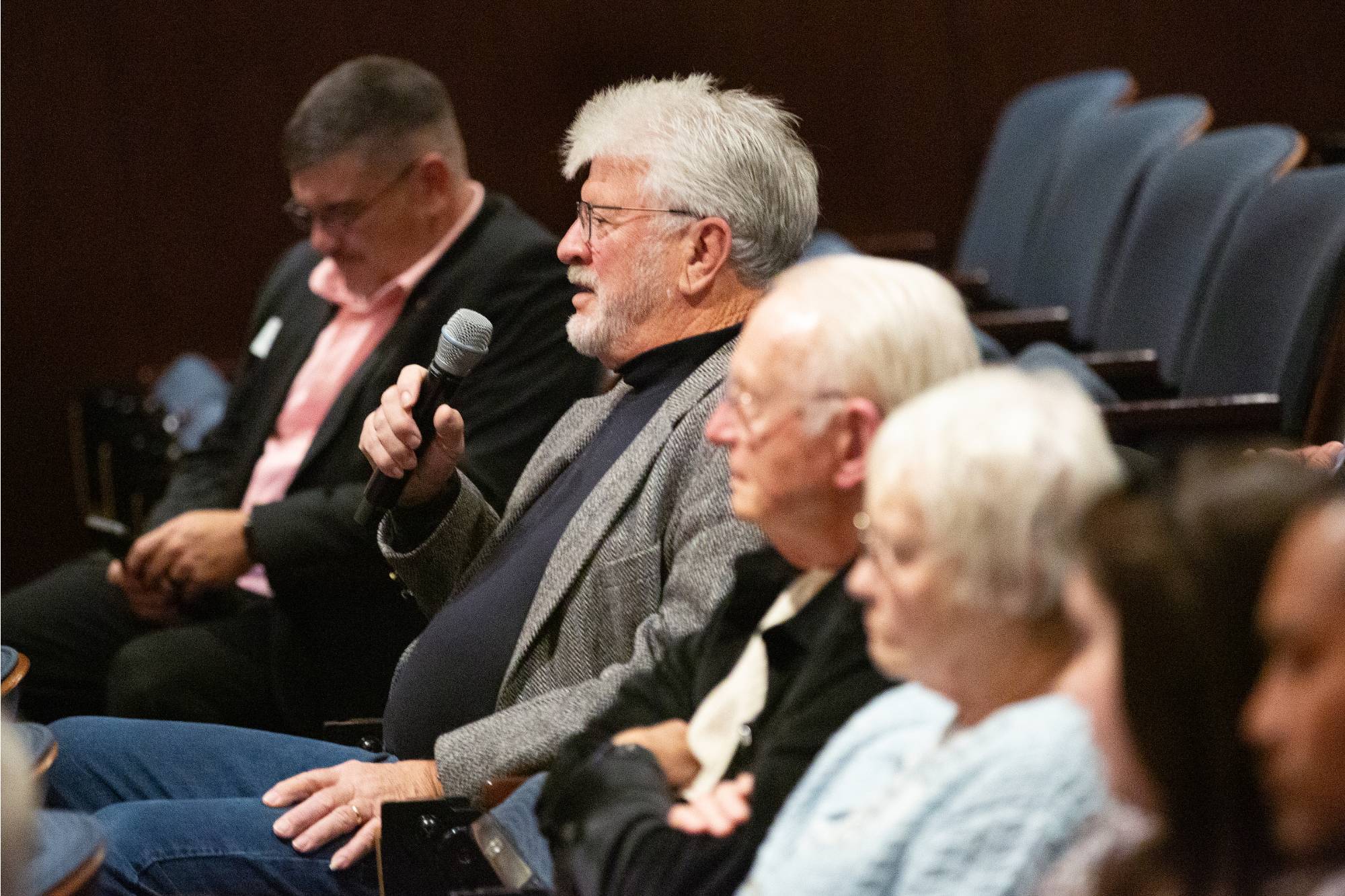 a man asks a question in the audience